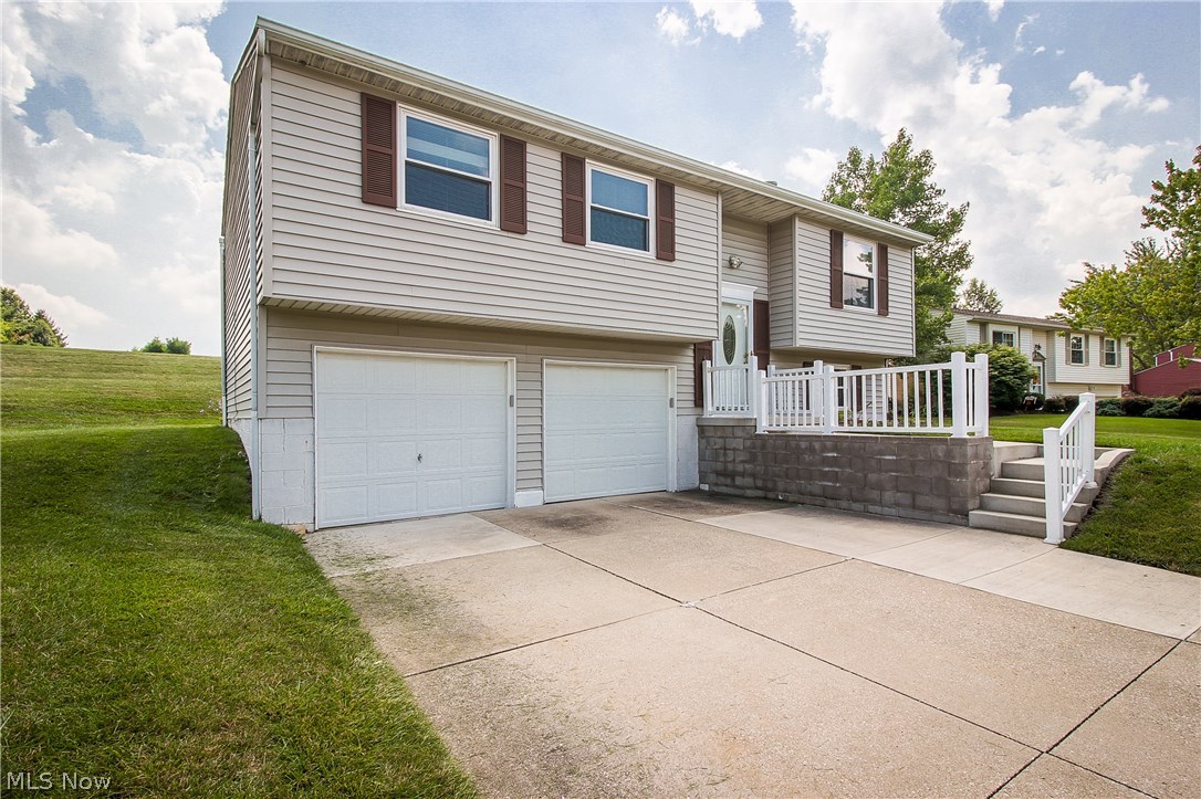 Located on a Cul de Sac and in the Green school district! As you step through the front door, vaulted ceilings give this home a spacious feel.  Take the stairs to the second floor, you will find the living room offering a picture window.  This opens into the kitchen, which has been remodeled and offers stainless steel appliances,  newer cupboards and tile flooring that looks like wood. The kitchen also has a sliding glass door that leads out to the deck with gazebo, which is great for entertaining. Down the hallway, you will find the master bedroom, two additional bedrooms, and a full bath.  The lower level of the home is partially finished with a rec room and half bath.  Updates include kitchen remodel 2013, half bath added 2013 bathroom remodel 2010, furnace and A/C 2008- All dates approximate. One owner home!
