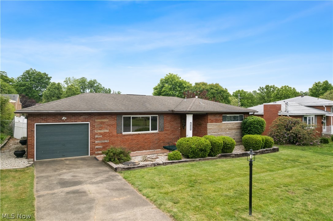 Beautifully maintained classic brick ranch offering 2.5 baths and timeless charm throughout. Currently listed as a 2-bedroom home, the original 3-bedroom layout can easily be restored, as the third bedroom is presently being used as a formal dining room.

The main level features gorgeous hardwood flooring throughout, with ceramic tile in the kitchen. Downstairs, the partially finished basement provides incredible additional living space, including a full second kitchen complete with sink, refrigerator, and stove, a spacious 28x13 family room, and plenty of storage in the unfinished areas.

Step outside to enjoy the newly remodeled screened-in back porch — the perfect private retreat for morning coffee or evening relaxation — overlooking the level, freshly landscaped, privacy-fenced backyard.