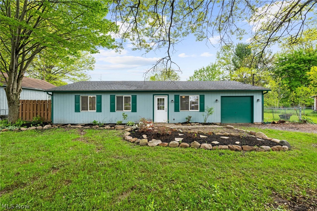 Welcome home to this beautifully updated ranch offering the ease of one floor living at its finest. This charming home features three spacious bedrooms, a large kitchen with ample space for cooking and entertaining and two separate living areas, perfect for relaxing or hosting guests. It's convenient first floor laundry is located just off the kitchen along with an attached garage for added functionality. Situated on nearly a full acre, the expansive yard offers endless possibilities for outdoor enjoyment, entertaining, or simply enjoying the peaceful setting.
