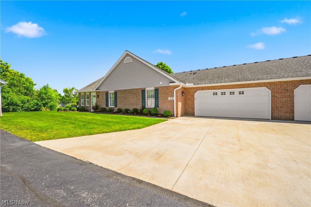 This is easy living at it's finest with this Lake Township ranch condominium in a 55+ community! You will know you're in for something special the moment you walk into the oversized sunroom with loads of natural light. Head through to the main living area and you're greeted by a living room featuring vaulted ceilings, a spacious entry, and an open concept dining/kitchen area. Well maintained carpet provides a cozy feel through most of the home as you make your way past the dinette area centered in the home. The kitchen provides wide walkways and ample countertop space as well as all the major appliances. Under-cabinet lighting gives a modern feel while the neutral colors make you feel right at home. To the back of the kitchen you'll find a large pantry opposite the half bath/laundry combination featuring an included washer and dryer. The spacious 2 car garage with workshop bench area is this way as well and provides quick access to the unfinished basement for all your storage needs. To the other side of the home you'll find two well sized bedrooms, one of which offering direct access to the large full bath thats centrally located. More storage is available in each of the rooms and at over 1,400SF the unit is a great size for all sorts of needs. The association offers loads of benefits such as landscaping, snow removal, and water at just $341 per. month. Don't miss your chance to call this wonderful community home, schedule your private tour today!
