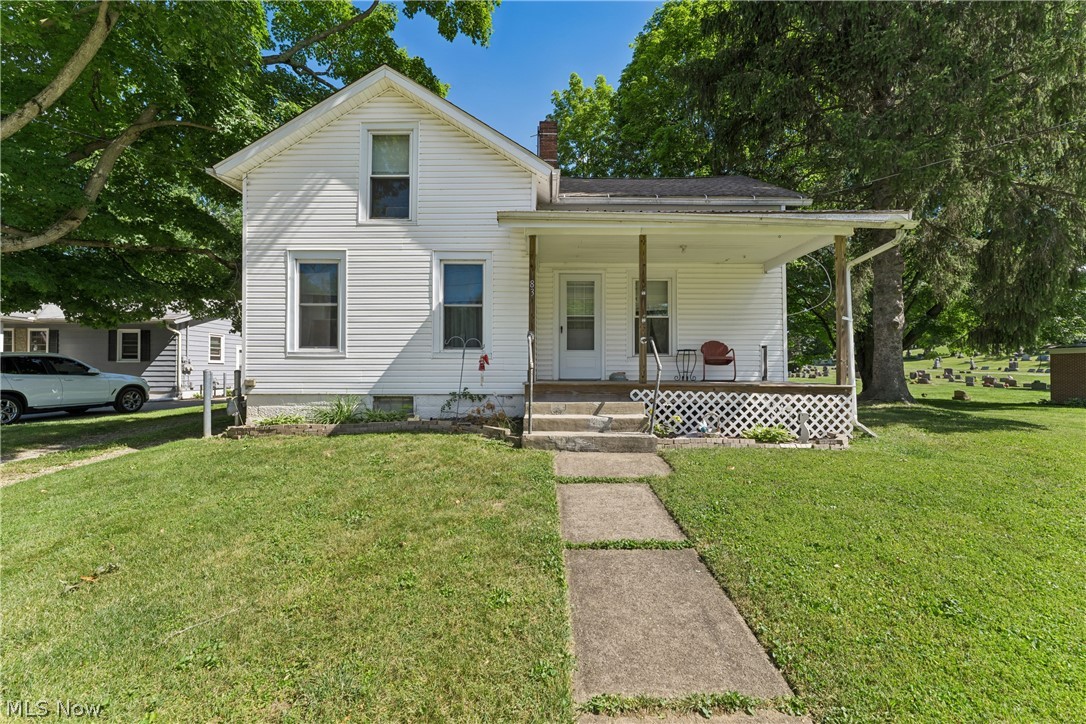 Welcome to this charming 3-possible-4-bedroom Century home located on a quiet street in downtown Seville. The main level features a spacious living room, an eat-in kitchen, convenient first-floor laundry, a bedroom, and a full bath, offering flexible living options. Upstairs, you'll find two additional bedrooms plus a tandem room that could serve as a fourth bedroom, home office, nursery, or hobby space. Outside, enjoy a 2-car detached garage complete with a built-in bar, perfect for entertaining or creating your own workshop retreat. Situated on two parcels, this property offers extra outdoor space and potential. Recent updates include the front porch (2014), furnace (2016), hot water tank (2017), vinyl siding (2019), windows (2020), and newer exterior doors. Bring your vision and finishing touches to make this home your own!