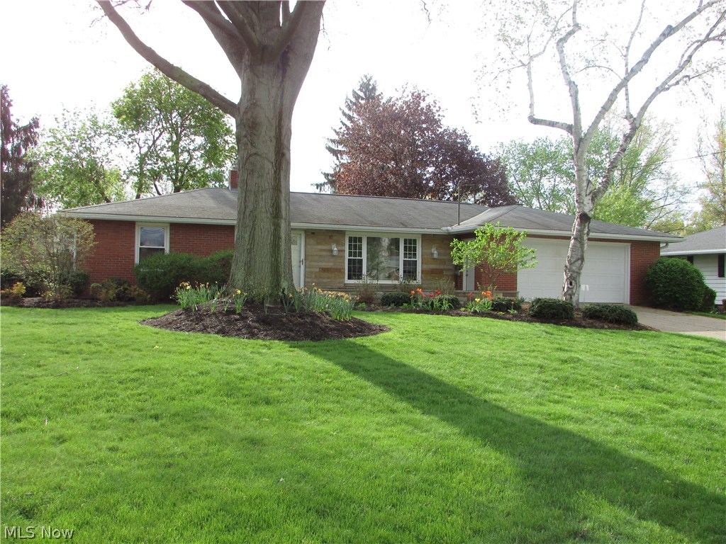 Wow!!  An exceptions 3 bedroom, 2 bath all brick ranch in Fairlawn.  This home boasts over 2100 square feet of living space.  An updated eat in kitchen has ceramic flooring.  The baths are updated as well.  An open living room has beautiful natural wood floors.  A fireplace highlights the large family room, that also opens to the back deck.  A 40x14 rec room in the finished basement also has a full bathroom attached.  The back yard is amazing... completely private with a wood privacy fence, a large wood deck, and a shed.  An attached two car garage, front porch, and large laundry area are just some of the amenities.