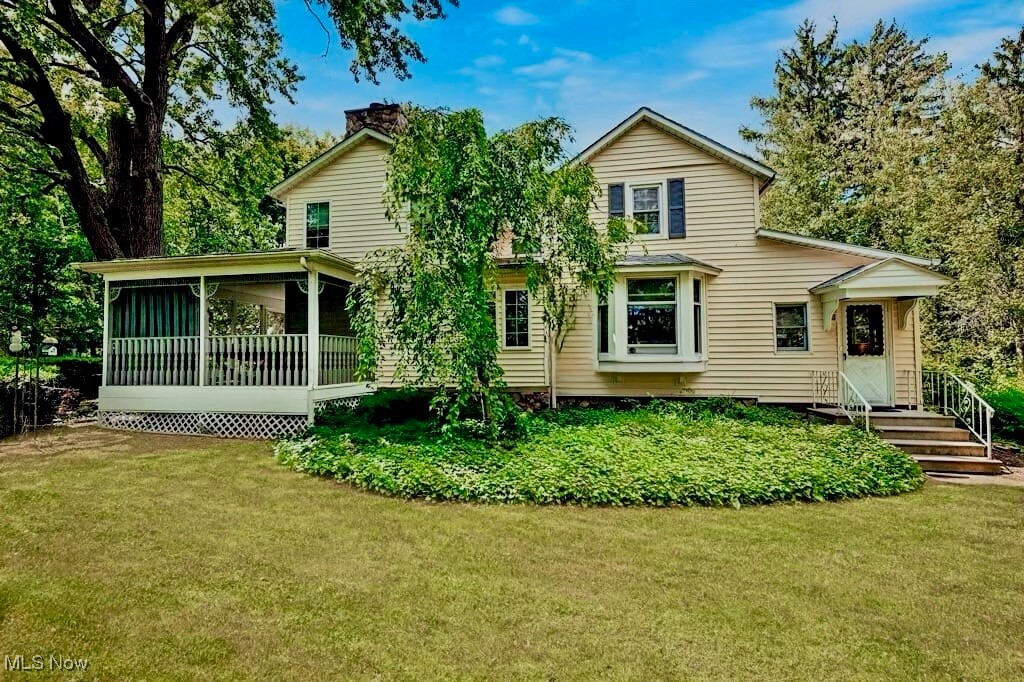 Here is your opportunity to own a classic and charming Colonial with thoughtful modern architectural updates, offering timeless curb appeal in a historic Medina setting. Situated on a picturesque one-acre, farm-like lot, this home blends peaceful country living with everyday city convenience.
Relax on the covered wraparound porch and enjoy views of mature trees and the soothing sounds of the waterfall pond. A path leads past the pond to a 30’ x 25’ barn with loft, formerly a one-stall horse barn—perfect for storage, hobbies, or future use.
Inside, the expansive great room is the heart of the home, featuring cathedral ceilings, exposed beams, skylights, and a dramatic two-story stone fireplace. A service bar with passthrough to the kitchen makes entertaining easy. The main level also includes a dining room with parquet wood flooring, an eat-in kitchen with island breakfast bar, laundry room, and half bath. From the dining room, step down into the bright four-season room with skylights, which also provides access to the front entry.
Upstairs offers a spacious primary bedroom (formerly two bedrooms), a second bedroom with skylight, a full bath with skylight, and an impressive loft overlooking the great room. The loft includes built-in cabinetry and window seating and can easily be converted into an additional bedroom, bathroom, or flexible living space.
Conveniently located near I-71, I-76, OH-18, Medina’s Victorian Public Square, recreation center, shopping, dining, parks, and golf courses. Updates include the great room addition and window replacement (approx. 2000),tied into the public sewer in 2024, and a 1-Year Home Warranty is included. Link for Youtube video tour https://youtu.be/VxX00lANqBk?si=co7g6YLy1ZurjewD