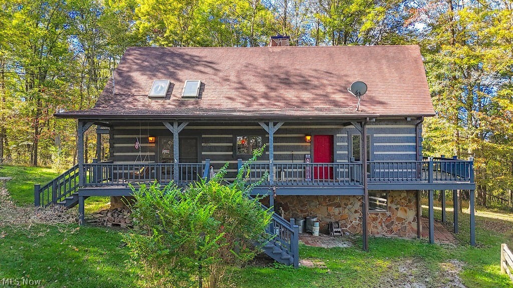Charming Log Home on 3.95 Wooded Acres!!  PRICE REDUCTION!

Driving up to this little log home, one of the features that definitely catches your attention is the panoramic windows! Once inside the home your eyes go to the windows as they allow for so much natural light and showcase the wooded views.  The main level offers a stunning stone fireplace, beautiful oak kitchen cabinetry, a cozy bedroom and full bath, while the second level hosts a spacious primary bedroom with an ensuite bath.  The lower level provides endless possibilities - ideal for potential additional living space.  This home is the perfect blend of rustic charm, privacy and the opportunity to enjoy country living!
