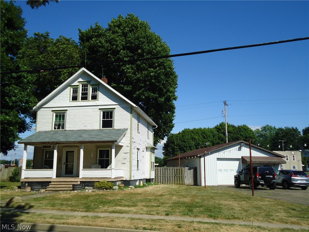 Charming  Century home with 3 additional buildings located on 2 lots (.558 acres)  One building previously used for auto sales/repair with auto lift, heat & office.
Large Pole barn building for storage .... & original garage.   Opportunity to live in the  home while running your business.  Zoned B-2 General Business District.  
Home features beautiful natural woodwork/floors.  Newer windows thruout  & fenced yard.   High visibility location perfect for many types of business.
Highly desirable Lake school district.  Call agent for details...