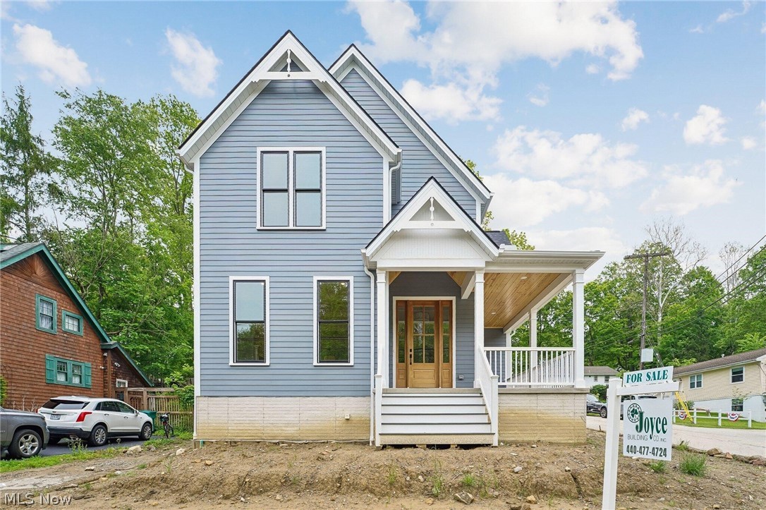 Welcome to this rare opportunity to own a charming new home in the heart of Historic Chagrin Falls. This property , features 4 spacious bedrooms with walk-in closets and 4 en suite baths. Enjoy cooking in the kitchen with custom cabinets, Thermador appliances and stone countertops. The dining area has direct access to the yard through sliding patio door and deck. Enjoy the family room with beamed ceilings and gas fireplace. The lower level features custom cabinetry and bar with beverage refrigerator. With an abundance of trim detail, built-ins, and crown molding, the home feels refined and intentionally designed. The property includes a 3 car attached, heated garage and a spacious yard for entertaining. Conveniently located walking distance to Chagrin Falls shops and dining.