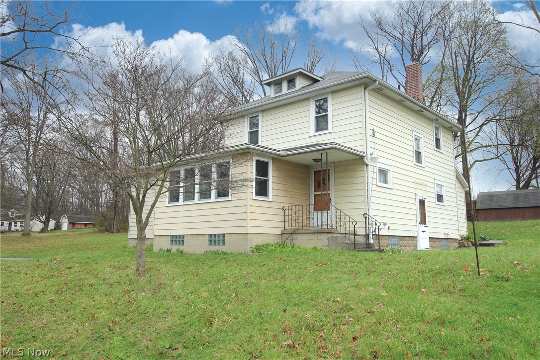 Welcome to 864 Mill rd.  A big lot on a quiet dead end road.  Easy access to Route 59.  5 minutes to downtown Ravenna, 10 minutes to KSU and downtown Kent. Pull up to plenty of parking with a horseshoe driveway and a two car garage. Walk from the garage straight into the basement where there is storage space galore! Along with laundry, a workshop and a pantry/can room.  Follow the stairs up to the kitchen and on the first floor you will also find the formal dinning room, a living room, sun room and an ENORMUS great room! So much potential for the first floor due to this space. Use it as a family room, play room, library, home gym, or with a little demo you can open up the rest of the main floor for a huge open concept floor plan. Endless possibilities there!  Up stairs you will find the 3 bedrooms and bathroom.  Enjoy mornings in the sun room on the front of the house or head to the seasons room on the back end where you can see the whole double lot.  Come see for yourself all the thin