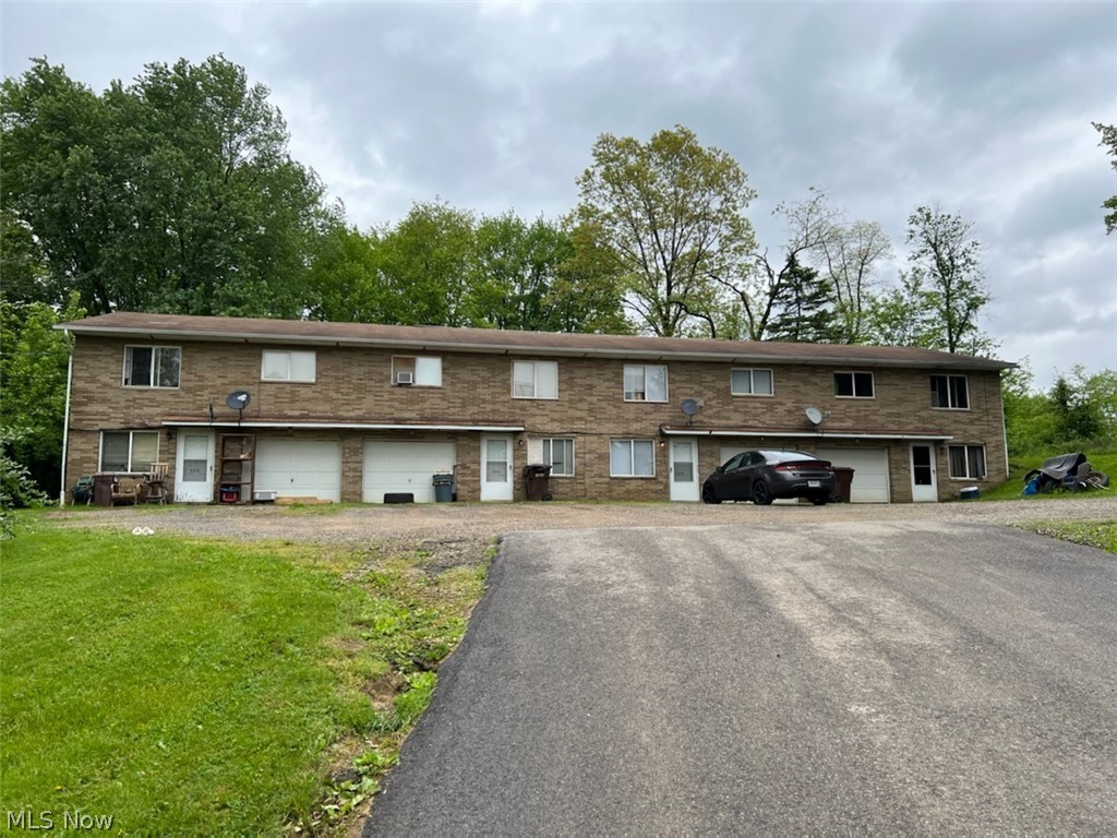 ATTENTION INVESTORS!  Looking for an investment property that has earning potential?  Four great units each with a 2 car tandem garage, walk out finished basement, a designated laundry room, and 100% occupied!  Most of the tenants have been there for some time, and all would like to stay.  With some upgrades to this property the rewards would increase.  All utilities (except water/sewer) are paid by the tenants.  Selling "As Is".