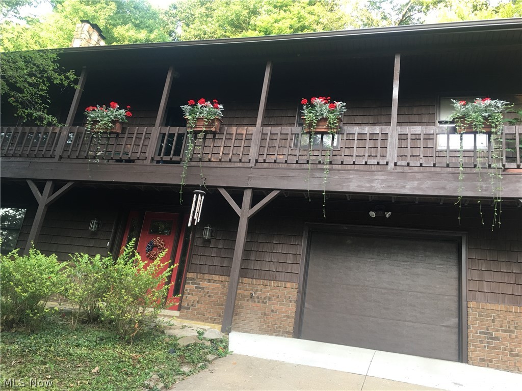 This is a beautiful home in spectacular Lake Buckhorn community. Many Substantial Improvements: 40-year Roof:(2008); New Furnace & Central Air(2017); New Vinyl Siding & Gutters w/Leaf Guard(2016); Downspouts (2019); HWT(2020) Owners added a 896 sqft addition in 2013. The addition is a Guest Quarters which is great for visitors to your new lakehouse with a Great Room above the guest quarters. The guest quarters has a well-laid out kitchenette, sleeping area and private bath and adjoins the recreation room. It also has double doors that walk out to a lovely patio/firepit area.  This is a very spacious home which features a nice open floorplan with a 18x15 2-story living room w/ a soaring fireplace(insert); a 27x16 great Room with built-ins and lots of windows adjacent to the living room; large Loft overlooking the living room; spacious kitchen w/ an island breakfast bar; 16x13 dining room; lower level rec room, 1st Floor Master Bedroom & 1st Floor Laundry.  There are 4 bedrooms & 3-1/2 B