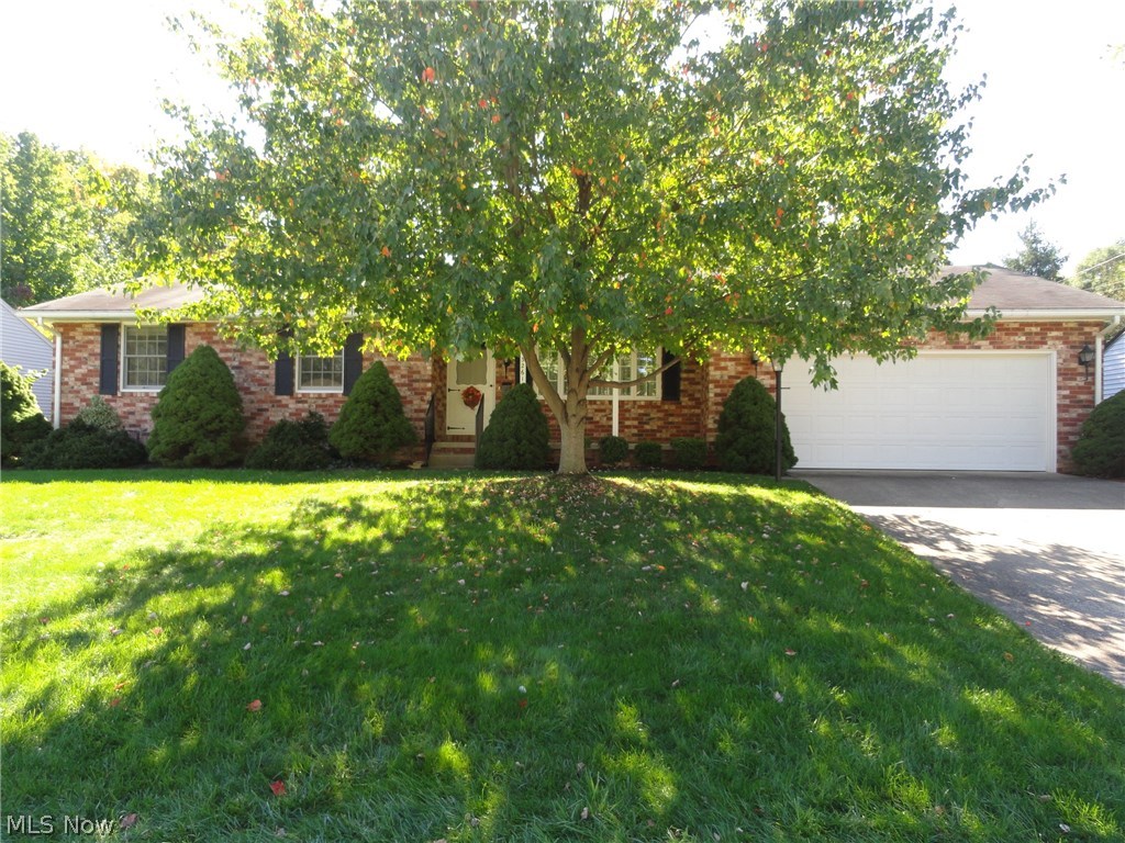 Beautiful brick ranch in excellent condition.  Original owners lovingly maintained this home since 1964!  Elegant living room with crown molding and chair rails, gas fireplace with lovely mantle and big picture window.  Cheerful kitchen with original hard rock maple cabinets in beautiful condition.  Stainless refrigerator, counter top range & newer oven.  Dining area with gas fireplace, bay window and door to 14 x 8 covered patio overlooking brick patio and lovely private backyard.  25 x 15 rec room with wood burning stove and built in cabinets, work room plus 2nd full bath.  New furnace!  Many new windows & doors.  2 car attached garage with pull down access to attic.