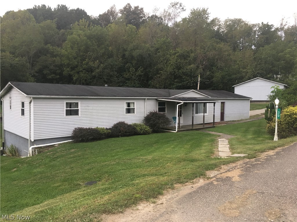 The home is located in Lower Salem Ohio is secluded back of the main road and has a nice yard, outbuilding and attached garage.  Inside has plenty of room with 3 bedrooms and one and a half baths. Home is on a permanent foundation and has maintained landscaping in front of the home. Home being sold as is where is.