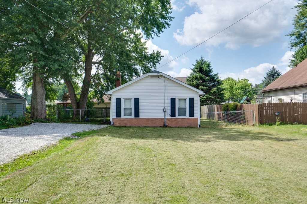 NOW, Look at This...Unique 2 bedroom ranch with open feel. You are invited in by the vast great room, soaring vaulted ceilings with exposed beams and unique newer lighting. Lots of updates have been done to this Super Cool Crib. Updated kitchen with some new cabinets 2020 and 2 year old appliances that stay.  New vanity in the bathroom.  New LVT in the great room 2020. Fenced yard.  If you are looking for something different come check out this One of a Kind in Mogadore.
