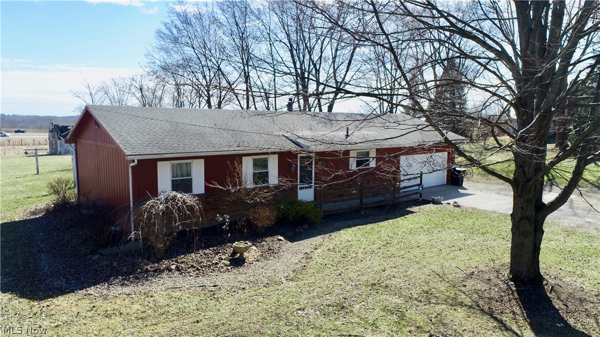 Welcome home to this 3 bedroom ranch in a prime location! Reap the benefits of country living on 2 acres while taking advantage of the easy highway access.  The kitchen has been tastefully updated including granite counter tops and is ready for you.  The cozy living room features a fireplace and sliding doors leading to a patio and great views of the spacious back yard.  The three bedrooms and 2 full bathrooms are just awaiting your personal touch to make them your own.  Need more space? The basement is great for storage or could be finished to add living space. Outdoors you will find the perfect spot for your hobbies and enjoyment. A newer roof, newer concrete patio and parking pad will save you thousands. A new garage door has also been added.  Schedule your showing today!