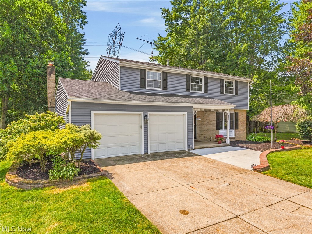Welcome home to this beautifully maintained 4-bedroom, 2.5-bath Colonial that blends timeless charm with modern updates. From the inviting covered front porch to the spacious interior, this home is designed for comfortable everyday living and entertaining.

Step inside to discover fresh paint throughout, creating a bright, move-in-ready feel. The spacious dining area features beautiful built-in shelving. The kitchen offers rich dark cabinetry, a stylish subway tile backsplash, and plenty of workspace, flowing seamlessly into the home's living areas.

Upstairs, the private primary suite is a true retreat with a walk-in closet and a full en-suite bathroom. Three additional bedrooms and another full bath provide plenty of space for family, guests, or a home office.

Outside, enjoy relaxing or entertaining on the backyard deck overlooking the yard, while the attached 2-car garage offers convenience and extra storage. For added peace of mind, the roof was replaced in 2024.

With its classic Colonial layout, thoughtful updates, and desirable features throughout, this home is ready for its next owner to move right in and make it their own. Schedule your private showing today!