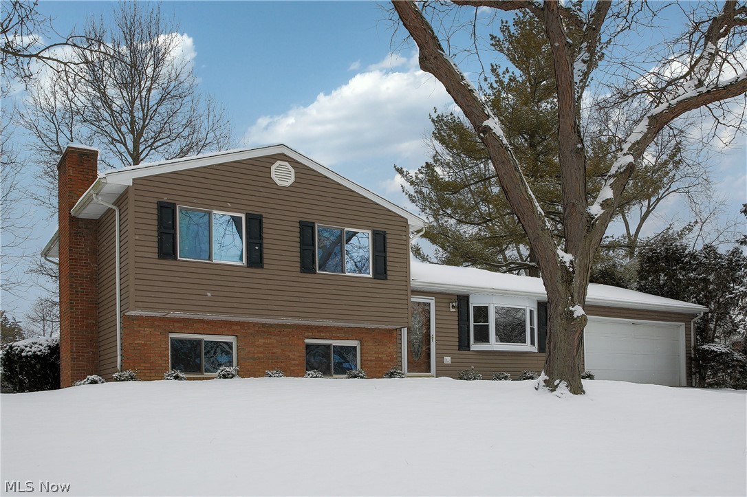 Located in the Wyoga Lake Community this four level split home has been well cared for. Beautiful curb appeal w/ updated exterior! Entering in the front door you’ll see the living room has an eye catching vaulted ceiling w/ wood planking & ample sitting room for guests. Transcending from the living room into the dining room & kitchen area’s you’ll notice it has a nice flow with open walls for family & entertaining that can be further expanded to the adjoining four season room w/ direct access thru the kitchen featuring wood plank ceiling as well. Further outdoor entertainment can be enjoyed on the back patio & large quiet backyard /natural gas grill. Bedrooms have adequate size on the upper level w/ an updated full bath. The lower level family room is spacious with a wood burning fireplace w/ gas light option during those chilly winter nights w/ Rec Rm or Dining Area & separate Private updated full bath.  Basement area has more than enough storage area w/ cabinets & has been waterproof