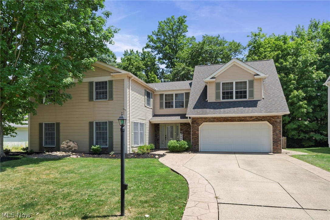 Welcome Home to this Sprawling, Custom-Built Colonial offering 2,932 Square Feet of meticulously designed Living Space, featuring 5 Bedrooms, 3 Baths and High-End finishes throughout. Step inside a Welcoming Foyer complete with a Cedar Coat Closet. The Chef’s Kitchen is loaded with Modern Soft-Close Cabinetry, a Central Island with Breakfast Bar w/Shelving, Gleaming Granite Countertops, Sink w/Instant Hot Water plus a Generous Sized Walk-In Pantry. All Stainless-Steel Appliances Stay including Dual Ovens with a Convection Oven. The Main Floor flows effortlessly, offering a Spacious Living Room, Formal Dining Room & a Cozy Family Room anchored by a WB Fireplace w/Custom Built-Ins.  The Second Level is a True Sanctuary. Primary Suite features a Massive 12’ x 9’ Walk-In Closet & a Spa-Like Ensuite Bath, fully equipped w/a Jetted Tub, Granite Dual Sinks, 10-Head Steam Shower & Your Own Private Dry Sauna. In Addition to the Primary Bedroom there is a 29’ x 20’ Bedroom/Multi-Functional Room w/a Large Walk-In Closet that serves as a Second Primary Bedroom or the Perfect In-Law/Older Child Suite. Three Additional Generous Sized Bedrooms w/ Ample Closet Space all include Bamboo Flooring. Additional Updated Full Bath with Granite. Second Floor Laundry adds ultimate Convenience, complete w/a Granite Counter, Utility Sink & 2020 Washer & Dryer Included. Outback, Your Private Oasis Awaits. Relax in the Enclosed 3-Season Room w/dedicated Hot Tub Hookup, or step out onto Multiple Stamped Concrete Patios featuring Built-In Seating – Perfect for Entertaining. The Fully Fenced Wooded Backyard Offers Privacy & Safety for the little ones. Additional Highlights include a Practical Mudroom leading to the 2-Car Attached Garage w/ Extra Storage Areas, Dual Furnaces & A/C Units 2025, Hot Water Tank 2019, Whole House Surge Suppressor & Home Security System plus Surround Sound Wiring. No Worries- Home Warranty Included! Welcome Home!
