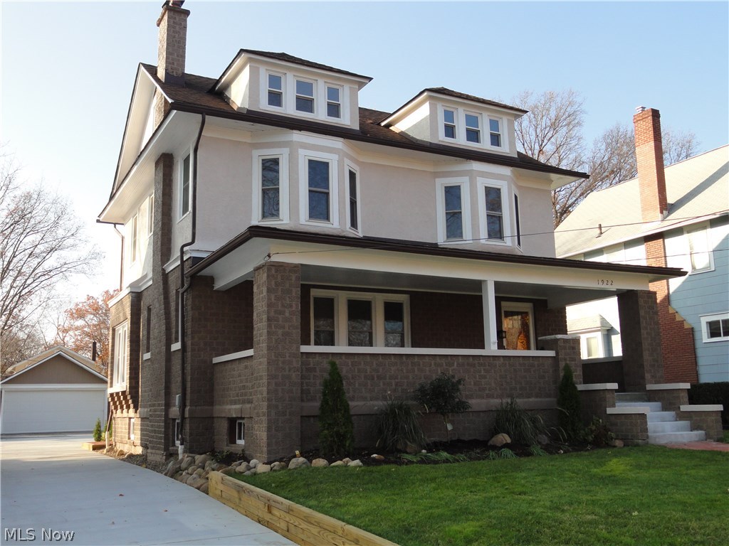 Welcome home to 1922 6th Street, a charming classic brick Colonial in a desirable Cuyahoga Falls location.  Extensively and tastefully renovated  throughout with careful attention to strive for excellence and quality with every detail.  Large front porch steps in the foyer entry with marble floor and decorative pillars.  Spacious living room with wood burning fireplace, high ceilings, crown molding and gorgeous hardwood floors that all continue into the formal dining and kitchen.  The dining room has a window seat and floor to ceiling vintage built in cabinets with leaded glass doors and stained glass insert. The new kitchen is stunning, it has been opened to the dining room and has Tuscan styled cream cabinets, granite counters, tile back splash and high end stainless appliances. A mud room and 1/2 bath complete the first floor.  The 2nd floor offers 3 light & bright bedrooms, 2 of them have bay windows, all with new carpet . Sparkling new main bathroom with jetted tub, separate showe