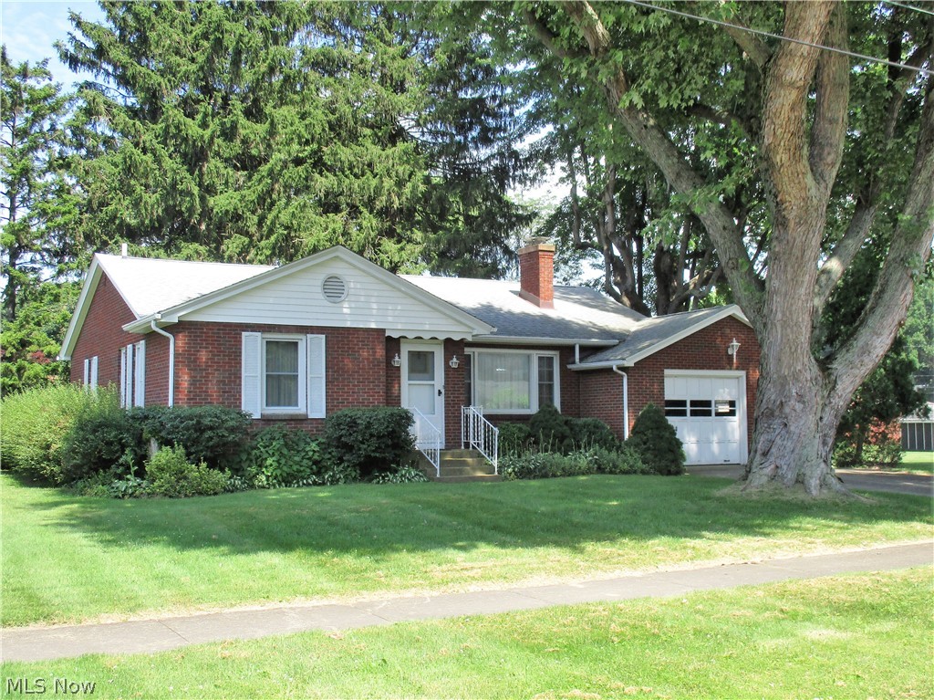 What a great brick home. 2-bedroom, 1-bath ranch with hardwood floors, arched doorways, wood burning fireplace with built in bookshelves. Vinyl windows, full basement with rec room w/ built in bar, stool, laundry area, big workshop area and work table.  1-car attached garage and for the history buffs – bomb shelter room in the lower level.  Central Air. Located on .29-acre lot with concrete drive. Roof is approximately 8-9 years old (Puffer Roofing) vinyl windows approx 12-15 years old. Wood burning fireplace with cupboard from the garage for easy wood handling.  Fireplace hasn't been used in many years.