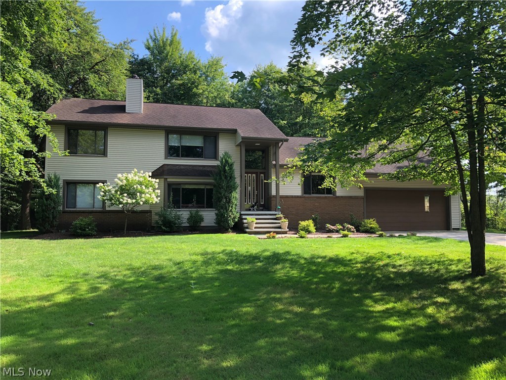 A wonderful opportunity is waiting for you in Kirtland! This custom built, one owner home sits on a corner lot with over 2 acres of land on a private, dead end street just across from Lake Farmpark. This 3 (possibly 4) bedroom, 2 1/2 bath split level home offers plenty of space for everyone. There are two family rooms, two fireplaces, private office, (which could easily be converted to fourth bedroom) plus a large basement rec room and storage galore. The kitchen space has functionality and includes all newer stainless steel appliances. The main floor laundry/mudroom has convenient access to the backyard. Outside the deck over looks the beautiful tree lined yard just waiting for your spring and summer entertaining. Just move in and enjoy!