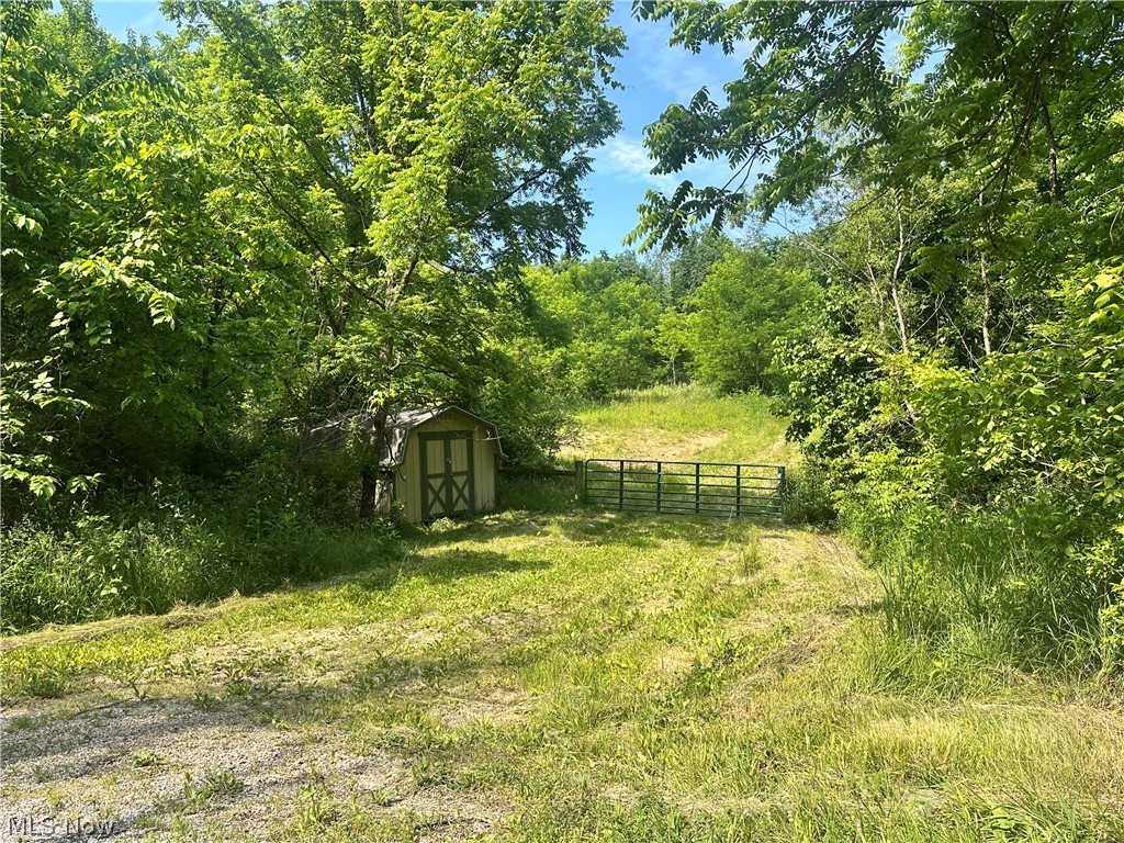 Don't wait for hunting season to secure your next great property. This 47+ acre private retreat is ready today — proven hunting ground, zero compromises. Tucked back from the busy road just 6.1 miles from Cambridge (minutes from the Highway 77/70 junction), this parcel delivers rare seclusion without sacrificing convenience. Whether you're a serious hunter, an outdoor enthusiast, or someone who's been quietly dreaming of building on your own terms, this land checks every box — bring your building plans and create a permanent residence, a private recreational compound, or the ultimate weekend escape. Properties like this don't sit. Call today and walk the land before it's gone. GPS Coordinates: 39.992935, -81.660709