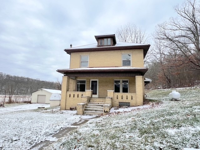 Picturesque country setting with gorgeous views of the countryside! This brick 2 1/2 story home has so much charm. It has original hardwood floors, natural woodwork, French doors, and an impressive fireplace in the living room. It is situated on 2.3 acres in the Harrison Hills school district. There are 4 bedrooms, 1 1/2 baths and a 24x30 detached garage. There is a full walk out basement. The  finished walk-up attic is great for additional storage or an extra room if needed. There is a brand new propane furnace. The property is ideal for a small mini-farm, and it abuts up to several hundreds of acres that has a potential to be used for hunting. Immediate possession is available. The seller is offering a $2,000 paint allowance.