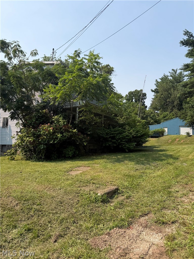 Bring your vision to this 4-bedroom, 1-bath farmhouse ready for its next chapter! Requiring extensive TLC, this property presents an excellent opportunity for investors, flippers, or buyers looking for a rewarding renovation project.

Situated on two levels of mostly flat yard, the property features a huge outbuilding packed with contents that convey with the sale. Per the seller, the outbuilding is believed to contain antique tools, cabinet-making tools and supplies, and vintage record player/jukebox-style machines—offering a true treasure hunt for collectors, hobbyists, or makers.

With endless possibilities and plenty of room to create something special, this unique property is being sold as-is. Buyers are encouraged to verify the condition and contents to their own satisfaction.