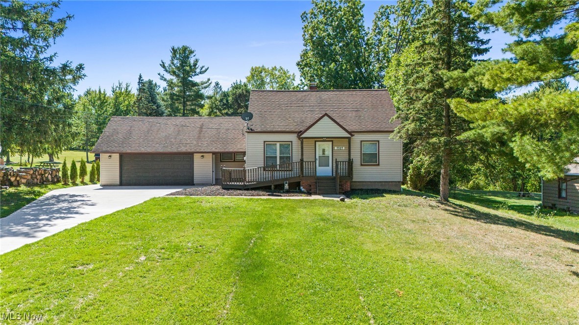 A beautiful, fully remodeled 4-bedroom home sits on a spacious 1.06-acre lot! As you enter, you are greeted by a formal living room filled with natural light, creating an inviting atmosphere. The open-concept family room is perfect for hosting gatherings with friends and family, seamlessly connected to the dining area and the stylish kitchen. The dining area features a sliding glass door that seamlessly leads to the rear deck, perfect for outdoor dining and entertaining. The kitchen features sleek white cabinets, black hardware, granite countertops, a backsplash, and stainless-steel appliances—all included. The first floor boasts three generously sized bedrooms, offering the ease of single-floor living. The updated full bath shines with a modern vanity, a tub surrounded by ceramic tile, and chic black accents. Upstairs, you’ll find a large fourth bedroom with a lofted ceiling, a closet, and built-in drawers for extra storage. The lower level includes a laundry area and additional storage space. Step outside to enjoy the serene backyard from your rear deck, complete with an attached gazebo, perfect for unwinding in the evening. Attached two-car garage. In addition, the impressive garage at the rear of the property, built in 2014, offers its own climate control system with air conditioning, making it an ideal retreat for car enthusiasts or those in need of a dedicated workshop for added convenience, a half bath has also been integrated into the space in 2024. Recent updates include a brand-new HVAC system, hot water tank, and air conditioning unit for the detached garage. Additional improvements feature a freshly poured concrete driveway, updated interior paint, and new flooring throughout—luxury vinyl plank in common areas and plush carpet in the bedrooms. The kitchen and bathroom have been fully renovated 2024. With its peaceful, park-like setting, this home is ready to welcome you with just the turn of a key! The owner is a licensed agent in the state of Ohio.