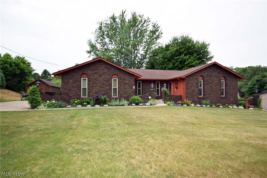 Look at this Ranch with full walkout basement and a gorgeous private setting! Spacious ranch finished with Spanish architecture. This home was built to last with bricked front, quality construction and insulated to the max for lower energy bills. Great room has vaulted ceilings, fireplace and a large patio door out to the deck which overlooks the backyard. Master suite includes master bathroom and large closet. 2nd and 3rd bedrooms are also on the first floor along with the 2nd full bathroom. Lower level is like another full house with full updated oak kitchen, living room with wood burning fireplace, full bathroom with jetted tub/shower and 2 other rooms. Spacious 2 car side load garage and large storage shed. Get ready to enjoy everything summer with this huge private backyard. Don't wait until this one is sold. Call to schedule your showing today!