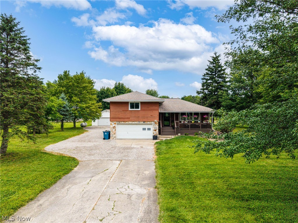 Enjoy country living on 2.06 acres in this well-maintained split-level home! This 3-bedroom, 1.5-bath home offers a functional layout with space to spread out inside and out. The welcoming living room greets you upon entry, while the lower-level family room provides additional living space along with a convenient half bath. The fully applianced kitchen includes a stainless steel refrigerator, range, and dishwasher, along with abundant cabinetry and a pantry cupboard for extra storage. Upstairs, you’ll find three comfortable bedrooms and a full bath featuring a tile-surround jetted tub. Outside, the property offers a 24’ x 32’ detached garage, ideal for vehicles, hobbies, or additional storage. The expansive 2.06-acre lot provides open space with a backdrop of beautiful mature trees, creating a picturesque setting to enjoy throughout the seasons. Don’t miss the opportunity to own this country property with room to relax, entertain, and enjoy the outdoors.