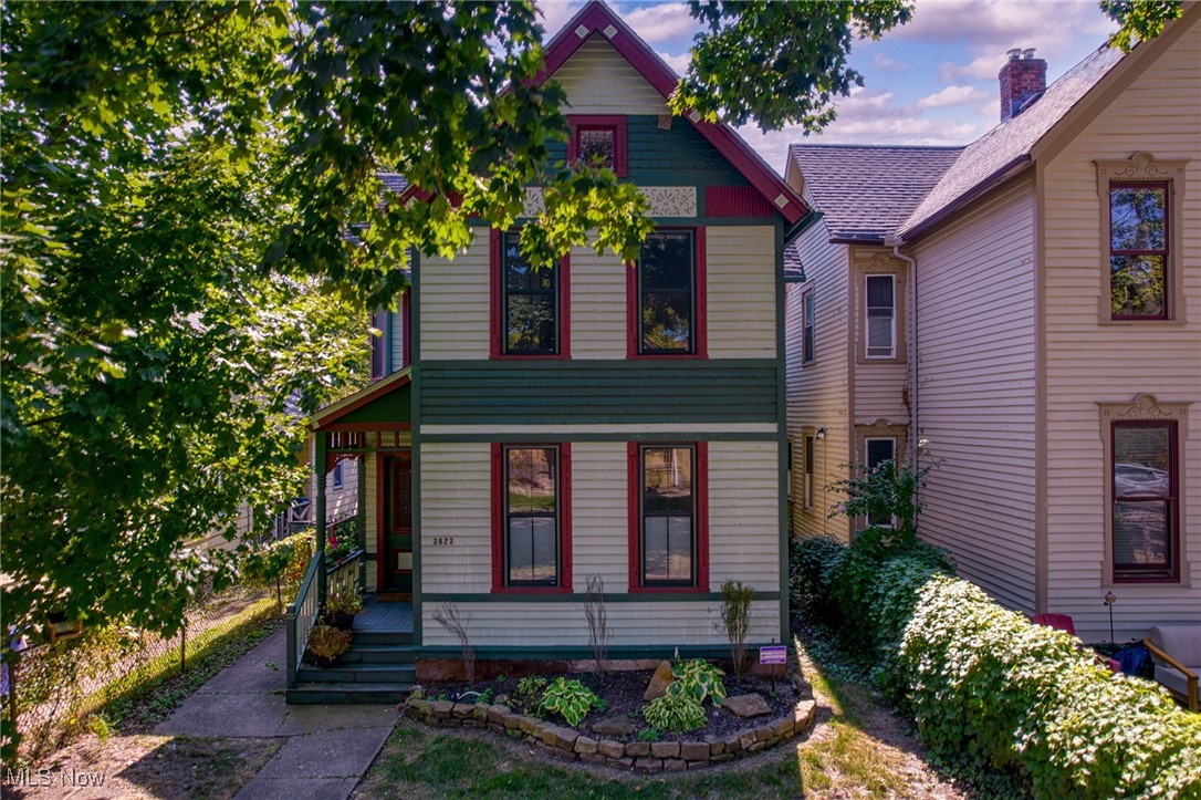 COMPLETELY renovated and TAX ABATED (through 2035!) TRIPLEX in the heart of Ohio City on historic John Avenue! Great opportunity to either owner occupy with current tenants in place in the two other units or to own a cash flowing property... can easily rent the vacant unit quickly! This property has been fully restored inside and out, blending preserved character with modern functionality. The curb appeal is undeniable with ornate wood siding, original front door, newer concrete walkway, newer roof coupled with energy-efficient windows and exterior doors. Occupants will enjoy a rare three plus car parking pad at the rear that enhances convenience for tenants and guests alike. Inside, the building was taken to the studs and rebuilt with a high-end design that today’s renters and owner-occupants crave. Each unit offers Carrara marble kitchen counters, custom ceramic tile bath floors and tub surrounds, vaulted ceilings, in-unit laundry, and abundant natural light. Modern mechanical systems throughout ensure comfort and efficiency, while every unit enjoys its own private exterior entrance for added privacy. The basement, accessible from the outside as well as the front unit, provides additional storage and utility access. The second-floor 2 bedroom / 1 bath unit is currently vacant and available for immediate showings with finishes that mirror the other two units. The downstairs front unit is 1 bedroom / 1 bathroom and rented for $1295 through 6/2026. The rear unit is 1 bedroom / 1.5 bathrooms and is rented for $1700 thru 4/2026. Whether you are seeking a strong investment property or a chance to live here while generating income from the others, this is a rare opportunity. Schedule a showing today and experience the best of historic charm and modern living in Ohio City. Set in one of Cleveland’s most desirable neighborhoods, this property is steps from West 25th Street, Hingetown cafés, restaurants, the Towpath Trail, Edgewater Park, and quick transit into downtown.