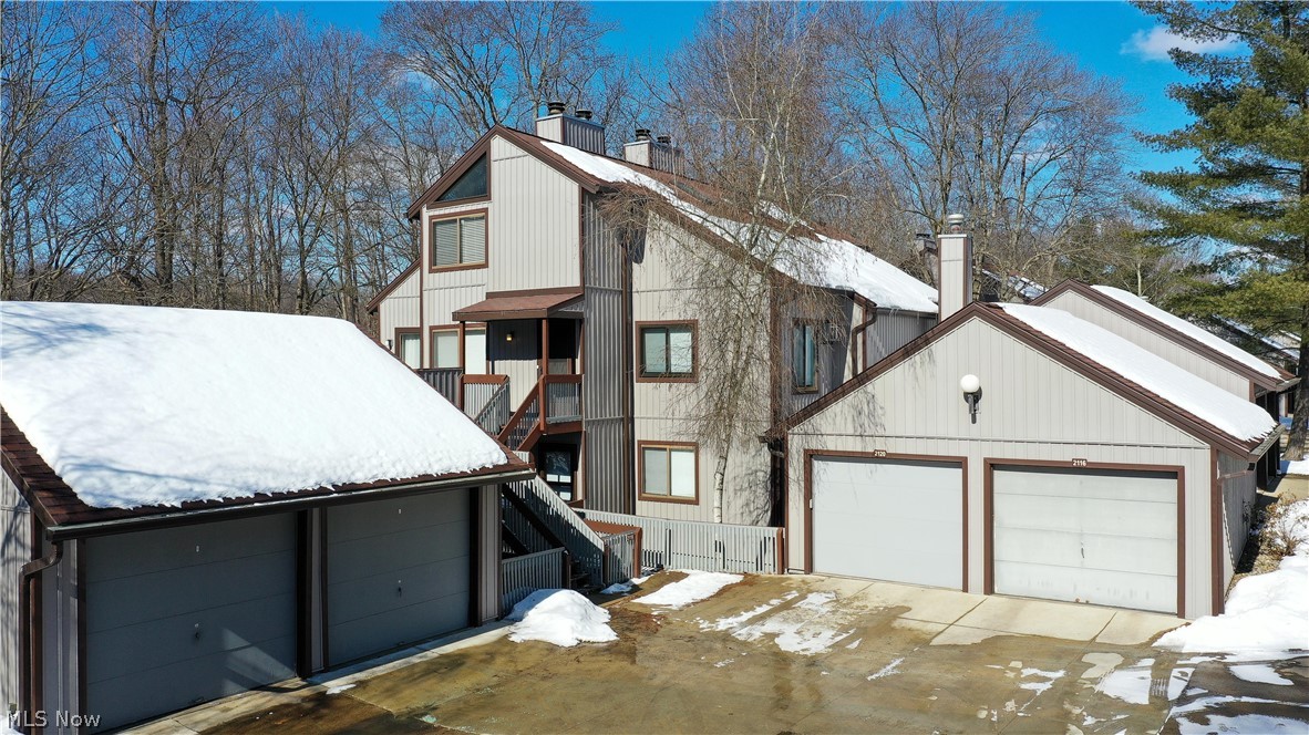 2021 Pinebrook Trail Cuyahoga Falls OH 44223 is stunning! Beautiful updated condo has 2 large bedrooms & 2 full bathrooms in the highly desired condominium Pine Mill complex surrounded by valley views of Northhampton area in the Woodridge School District. This condo has everything from plenty of storage, large rooms & gorgeous views to your own 1 car garage w/ new door. Main level consists of the professionally designed kitchen which has plenty of gorgeous cabinetry, granite countertops w/ lots of flow, stainless steel appliances, wonderful lighting & floating shelving to round out the area with the Breakfast Bar as well as open concept dining area surrounded by natural light. The Great Room has the most wonderful views of the woods surrounded by windows & sliding doors... absolutely magnificent, calming & nature, nature, nature. Ambiance of the fireplace wall & the open stairs with huge loft bedroom suite overlooking the Great Room w/ even more views! The main floor bedroom is large enough as it's own suite w/ multiple closets, hall full bath w/ shower, hall laundry (full size laundry) & LVT flooring in the main area. Upper floor huge master suite has vaulted ceilings, fully remodeled beautiful bathroom w/ 2 sinks, granite, plenty of light, huge walk in closet & enormous bonus  storage room!! Deck for outdoor living & animal watching! Includes inground swimming pool, lots of hiking, biking, parks, close proximity to the Market District area w/ plenty of eateries & shopping!