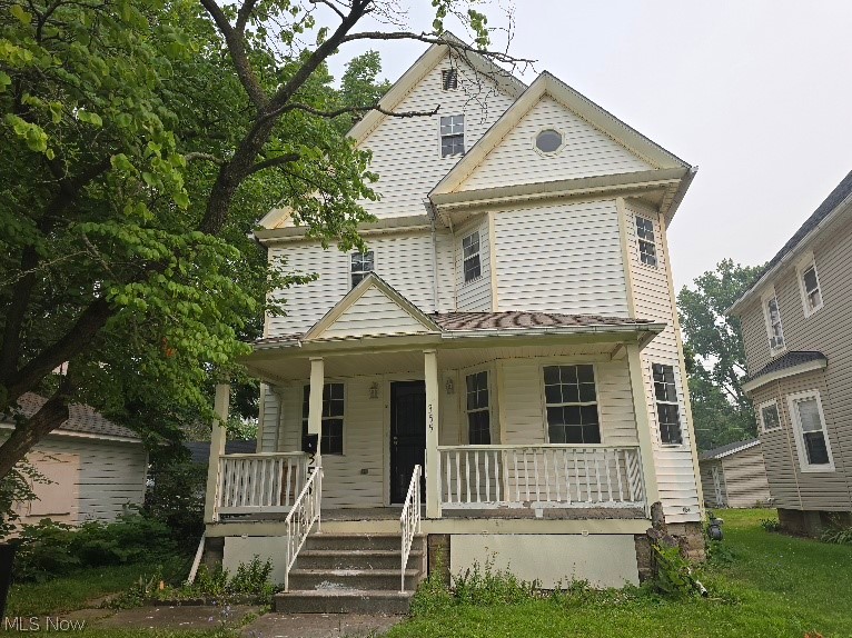 Charming 4-bedroom, 1-bath Colonial full of character and space! Relax on the inviting front porch before stepping into the spacious foyer. A classic pocket door leads to the large, open kitchen, offering plenty of room for cooking and gathering. The home also features a formal dining room and a bright, sun-filled living room. The second floor offers three comfortable bedrooms and a full bath, while the third floor provides a private fourth bedroom—ideal as a primary suite, guest room, or home office. Outside, you'll find a deep lot with ample space to build or replace a garage (on 11th St). A wonderful opportunity to make this charming home your own!