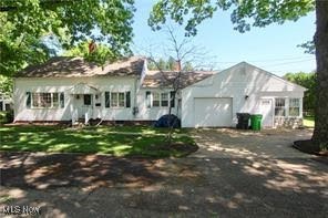 This home features a spacious layout with 3 comfortable bedrooms and 2 full baths.  The main level features the primary bedroom along with the kitchen, dining, living, and family rooms.  There is also a bonus room which could be used as an office, mudroom or any space to suite your needs.  The large sunken family room is a standout feature, offering a cozy yet expansive space for relaxing or entertaining. Large windows let in plenty of natural light, creating a warm and inviting atmosphere. The fireplace adds to the space and charm, making it the perfect place to gather during cooler months. The sunroom completes the main level.  The basement offers additional space for storage.  The other two bedrooms share a full bath on the upper level. This home provides a great blend of space, comfort, and functionality.
