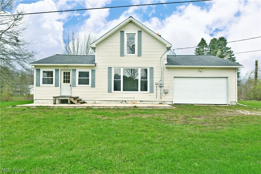 Enjoy the scenic views and lovely country sunsets from this renovated two story home! Offering farmhouse vibes with modern touches, the residence makes the most of its expansive corner lot; easily enjoyed from the covered rear patio space. Step inside and be meet with a wood trimmed foyer, showcasing closet space and lounge areas alike. The rusting hardwood flooring uses extra wide planks for a rustic, unique look. A large central kitchen opens with its massive footprint as cabinets line the far wall, joined with ample countertops. Plenty of space is available for dining as sliding doors go to the backyard. Around the corner, the living room with it's new carpet basks in the natural light from the oversized picture window. A full first floor bath makes for a convenient option. The hall continues to find a bonus room / office or mud room complete with laundry services. Up the newly carpeted stairway, a pair of oversized bedrooms include the spacious master where tons of closet space are found. An additional half bath bridges the rooms with bold colors and a tasteful vanity.  Roof is 10 years old - Garage Door is 10 years old -Brand New Carpet  - updated septic 2022. New heat pump and condenser were installed Dec 2022.