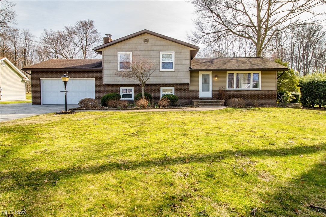 Don't miss your opportunity to see this home! This spacious, updated split-level has been meticulously maintained and is perfect for family and entertaining. with three bedrooms and two bathrooms.  The formal living room is open to the dining area and kitchen that showcases modern appliances and cabinets. The sliding glass doors lead to a sunroom and large backyard. The family room level includes a fireplace, laundry room, and full bath. The basement area offers room for storage, an office, or work room. The sizeable, landscaped backyard has a garden and a storage shed in the back. The home was painted throughout in 2024 along with the 2nd floor flooring.  1 year home warranty provided by sellers from American Preferred home warranty!