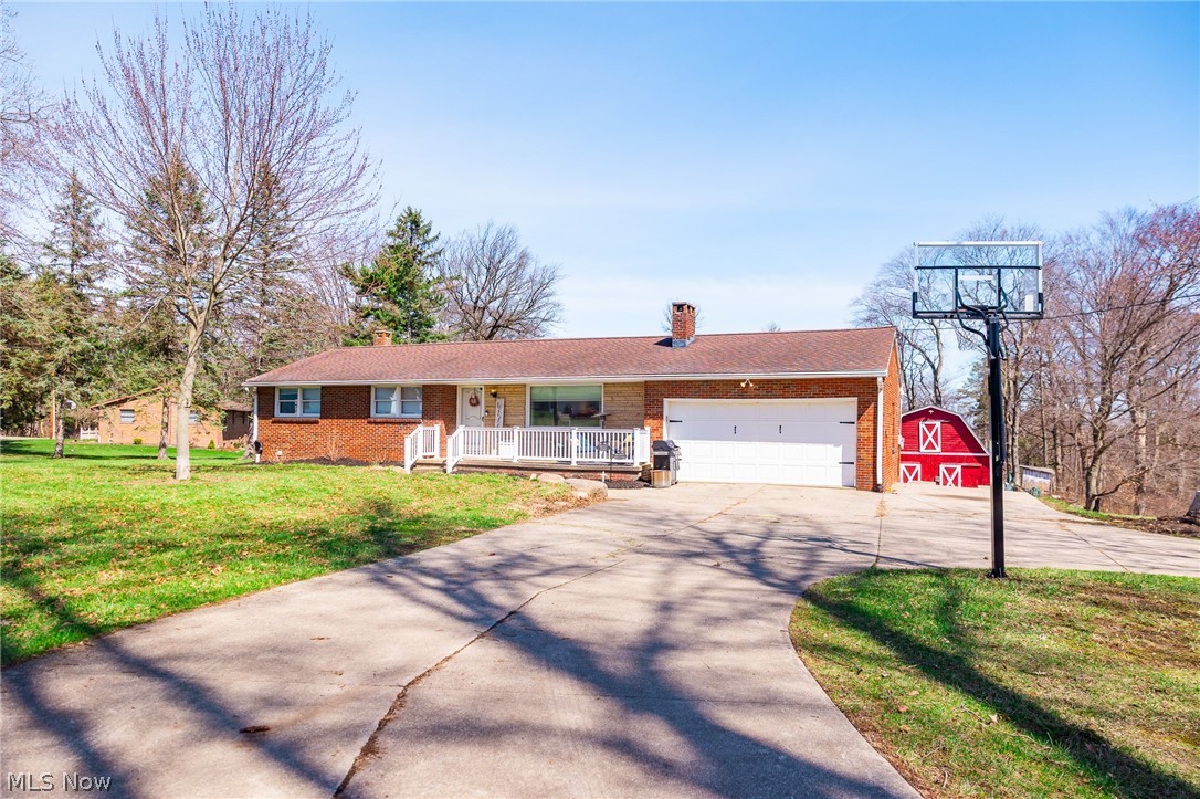 Online Only Auction June 8th. Beautifully updated brick ranch set on 10+ acres in the city of Rittman, offering the perfect blend of country living and in-town accessibility within minutes of Medina, Fairlawn, Akron.  This 4-bedroom, 2-bath home has been extensively updated, including all-new plumbing and electrical, a stunning custom kitchen with granite countertops, and fully renovated bathrooms. Behind-the-scenes improvements such as a new hot water heater and AC unit provide peace of mind and make this home truly move-in ready. The home is serviced by public water and a private sewer system, and the best part is free gas!!! Outside improvements are just as impressive, with updated exterior tiling and drainpipes that enhance drainage and long-term functionality. Also offering 0.55-acre building lot as a separate option. Bring your vision to life on this beautiful, level, ready-to-build setting and access to public utilities.