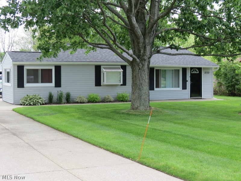 Looking for a move in ready home with one floor living--then check this one out!  Featuring neutral decor, gorgeous landscaping and TONS of updates-- you'll want to schedule this one ASAP!  Newer roof, vinyl siding and gutters --all just over a year young PLUS 2 year young central air conditioning unit!  Newer carpet in the hallways and bedrooms--plenty of space with four spacious bedrooms. Stamped concrete patio, driveway and sidewalk are newer too!  Hot water tank was replaced too in 2010!  Enjoy the view of the beautiful yard just in time for summer!