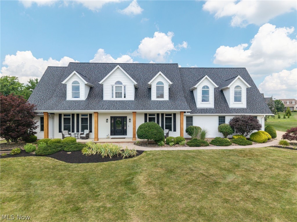 Beautifully reimagined and meticulously maintained, this custom Cape Cod in the prestigious Fox Meadows Golf Course community offers over 5,800 square feet of finished living space on a professionally landscaped .66-acre lot. With extensive updates inside and out, this home perfectly blends timeless design with today's modern style. A two-story great room welcomes you with a floor-to-ceiling stone fireplace and expansive windows that bathe the home in natural light. The spacious kitchen featuring Cambria quartz countertops, glass tile backsplash, abundant cabinetry, and updated lighting. The first-floor owners suite has been transformed with a completely renovated luxury bathroom (2025). A large walk-in closet completes this relaxing retreat. The finished lower level offers an additional living space with a spacious recreation area and a newly added full bathroom (2024), making it ideal for entertaining, guests, or extended family. Upstairs, spacious bedrooms and a versatile bonus room with its own HVAC system provide flexibility for a home office, media room, or playroom. Recent improvements include wide-plank hardwood flooring (2024), new carpeting in the great room, stairs and landing (2024), a renovated laundry room with new flooring (2025), updated lighting in the kitchen, dining room, and foyer, and professional interior painting throughout. Outside, the homes curb appeal has been elevated with painted brick, new wood columns, new shutters, and all-new exterior lighting, while the backyard offers the perfect setting for relaxing or entertaining with a Trex deck (2023). The oversized four-car garage has also been upgraded with a durable epoxy-coated floor (2025). Additional improvements include a new roof (2021), hot water tank (2020), and main HVAC system (2019). Residents of Fox Meadows have the opportunity to enjoy optional country club membership featuring championship golf, an elegant clubhouse, fitness center, and Olympic-sized zero- entry swimming pool
