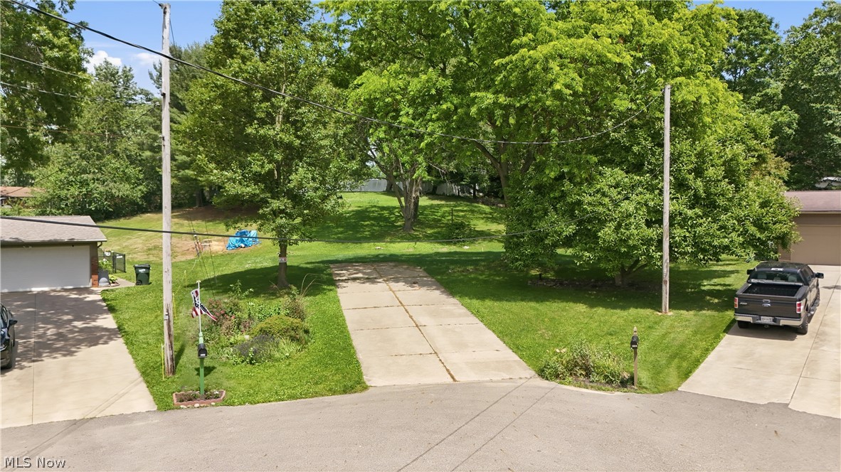 If you've been looking to build your new home in Plain Township, this may be the perfect location for you to bring your own builder! Situated on a pretty, low-traveled cul-de-sac lot, this lot already has a septic system and well water system in place, along with a driveway.  There are a few mature trees and a nice sloping backyard with a Shed, and the best part is that this home is in a nice established neighborhood in such a great location. You'll be close to the Plain Township Parks, Schools, the vibrant Oakwood Square and Legacy Park Plain Township Amphitheater. Country-feel living, yet minutes from wherever you need to be. No restrictions on what builder you can chose for your new home, at an affordable price. The current septic system in place has passed Stark County Health Department Inspection and can be provided.  A hard-to-find opportunity to build your new home on such a pretty, established setting.