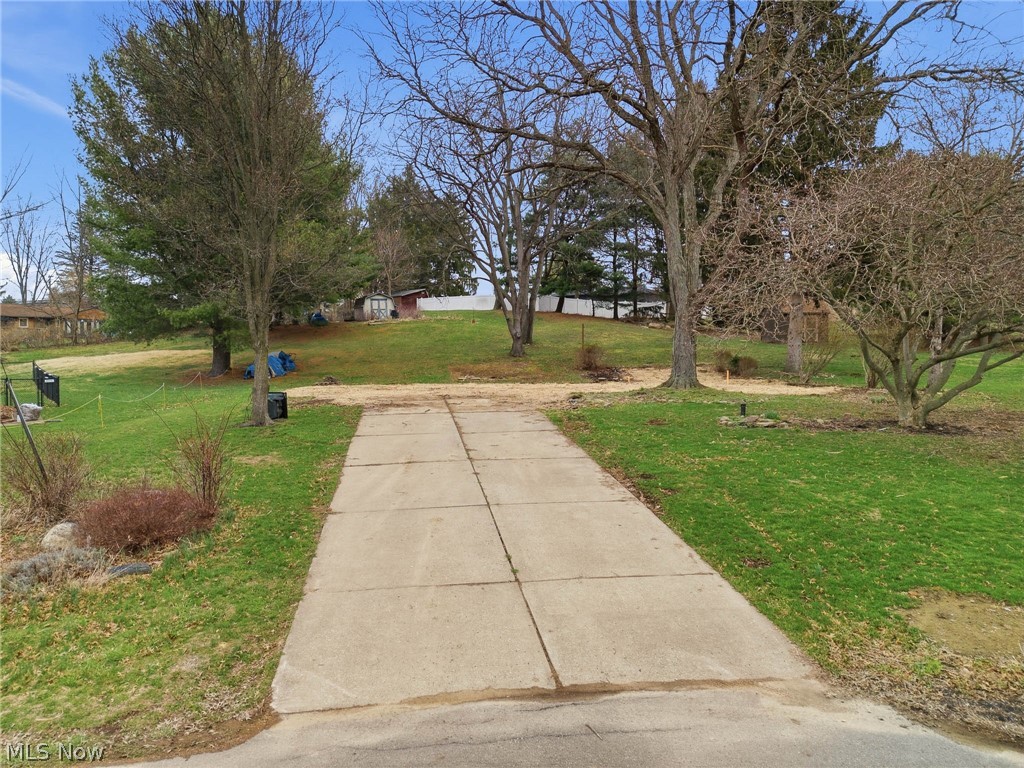 If you've been looking to build your new home in Plain Township, this may be the perfect location for you to bring your own builder! Situated on a pretty, low-traveled cul-de-sac lot, this lot already has a septic system and well water system in place, along with a driveway.  There are a few mature trees and a nice sloping backyard with a Shed, and the best part is that this home is in a nice established neighborhood in such a great location. You'll be close to the Plain Township Parks, Schools, the vibrant Oakwood Square and Legacy Park Plain Township Amphitheater. Country-feel living, yet minutes from wherever you need to be. No restrictions on what builder you can chose for your new home, at an affordable price. A hard-to-find opportunity to build your new home on such a pretty, established setting.