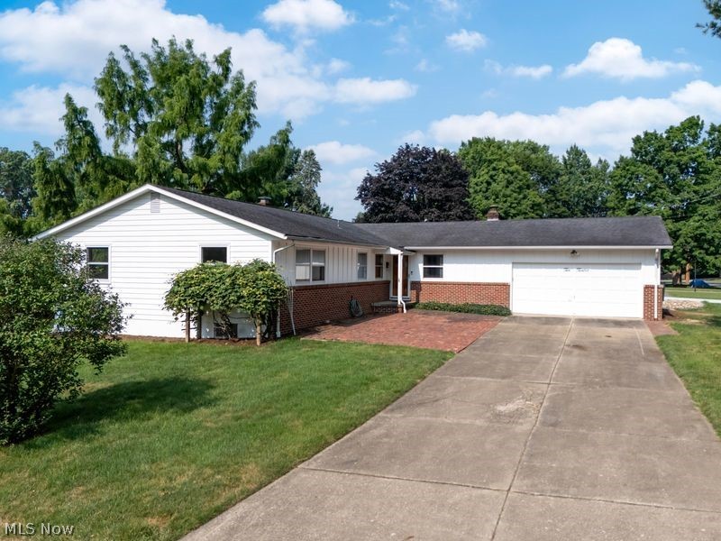 Ranch home with 4-bedrooms, 2-baths,  offering plenty of living space! Features include a spacious living
room with fireplace, large family room, eat in kitchen and a partially  finished basement with a generous rec room. The
primary suite includes a dressing area, walk-in closet, private bath, and tiled walk-in shower. Attached 2-car
garage and a desirable corner lot. Hardwood floor is under most of the carpeting.   A whole house generator if power goes out. Conveniently located within walking distance to schools. Don't miss this home with space for everyone!