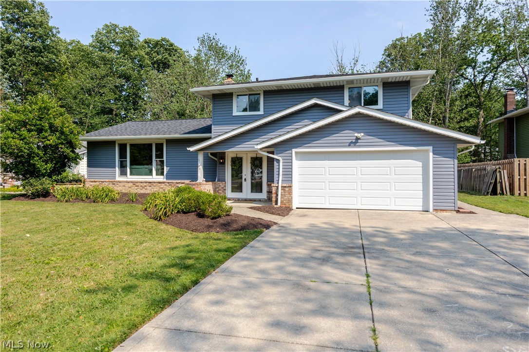 Tucked away in the sought-after Colonial Forest Estates neighborhood, this beautifully updated split-level has nothing left to do but move in! With 3 bedrooms, 2.5 bathroom home blends fresh, modern updates with warm, inviting charm.
Step inside through the new front door to soaring ceilings, beamed accents, and a stunning chandelier that set the tone for the light-filled main level. The updated kitchen shines with granite countertops, recessed lighting, and plenty of cabinet space, flowing effortlessly into the dining area and family room — complete with a cozy brick fireplace, perfect for gathering on cool Ohio evenings.
This home has been extensively updated, including a new roof, new siding, new exterior paint, new flooring throughout, remodeled bathrooms, a new garage door, and a new sump pump — giving you incredible peace of mind for years to come.
Upstairs offers three comfortable bedrooms with ample closet space, while the finished lower level adds even more flexible living space for a rec room, office, or gym. Enjoy central air conditioning, an attached 2-car garage, and a private backyard oasis featuring a spacious deck — ideal for entertaining or simply relaxing.
Don't miss your chance to own a move-in-ready home in one of Solon's most established communities!