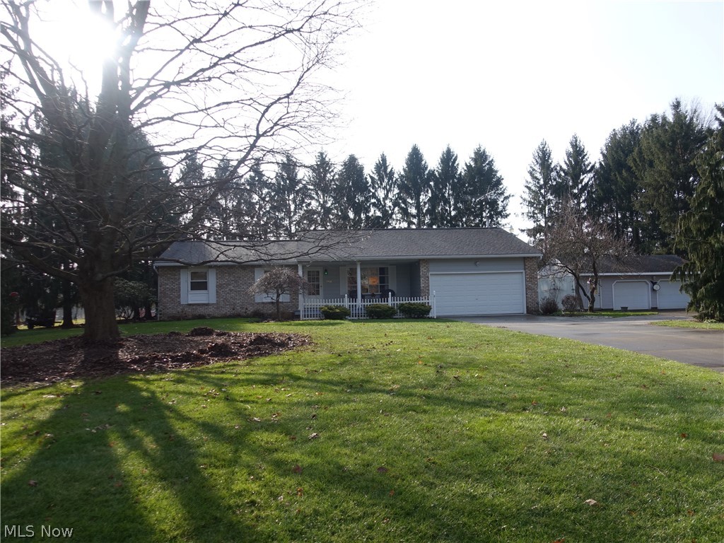 If your looking for an awesome ranch with the most incredible vaulted deck AND 4 1/2 car garage.....get excited...you just found it!  Spacious living and dining rooms with hardwood flooring, 3 bedrooms (main bedroom includes updated half bath).  Main bath offers Kohler jetted tub for your relaxation.  There's a lot of storage and counter space in the lovely kitchen, which features KraftMaid hickory cabinets, tiled backsplash, corian counters, and stainless steel appliances.    The kitchen adjoins the  family room, which features a beautiful wood burning fireplace to enjoy this winter and sliders to the amazing 14 x 16 vaulted deck with gorgeous views of the secluded and private property.  The lower level offers 2 finished rooms, which would be perfect for an office, exercise room.  Lots of storage.  The attached 2 car garage is very convenient and the detached 2 1/2 car garage would be perfect to house your vehicles, boat, toys OR use it as a workshop.  AC replaced in 2019, Roof (2004)