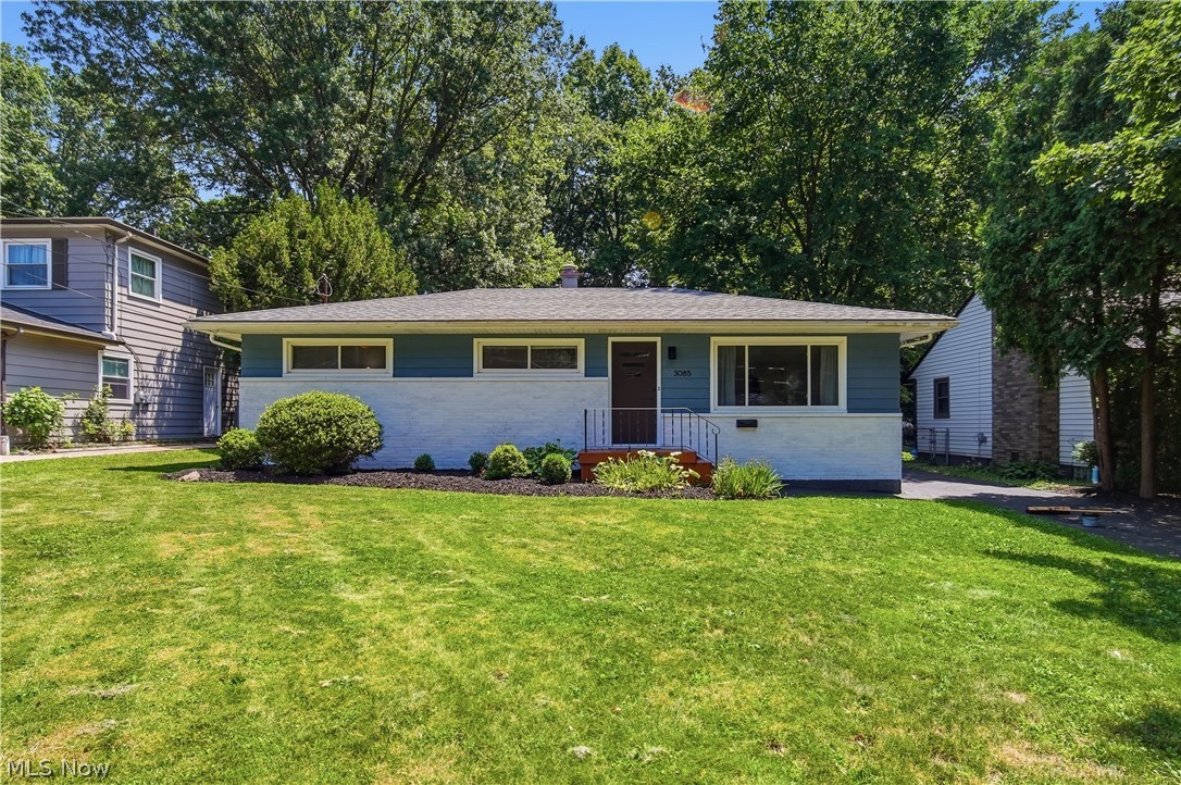 Charming Ranch in the Heart of Stow! Welcome home to this beautifully three-bedroom, two-full-bath ranch, tree-lined lot in Stow/Silver Lake neighborhood. From the moment you pull into the driveway, you’ll notice the pride of ownership — classic blue-and-white siding, mature landscaping, and a sprawling green lawn shaded by towering trees. Step inside to gleaming hardwood floors that flow throughout the open living spaces. The bright living room offers great natural light and flexible space for relaxing or entertaining. The updated kitchen is a true standout, featuring crisp white cabinetry, granite countertops, stainless steel appliances, and a peninsula with seating — perfect for casual meals or morning coffee. The comfortable bedrooms offer generous closet space and cozy touches like ceiling fans. While both full bathrooms have been tastefully updated — with a statement round mirror, wood accent wall, and dark modern vanity. Outside, enjoy a private backyard retreat, a detached garage (with a/c & heat!), and a long driveway with plenty of parking. All this just minutes from shops, restaurants, parks. Move-in ready and waiting for you — schedule your showing today!