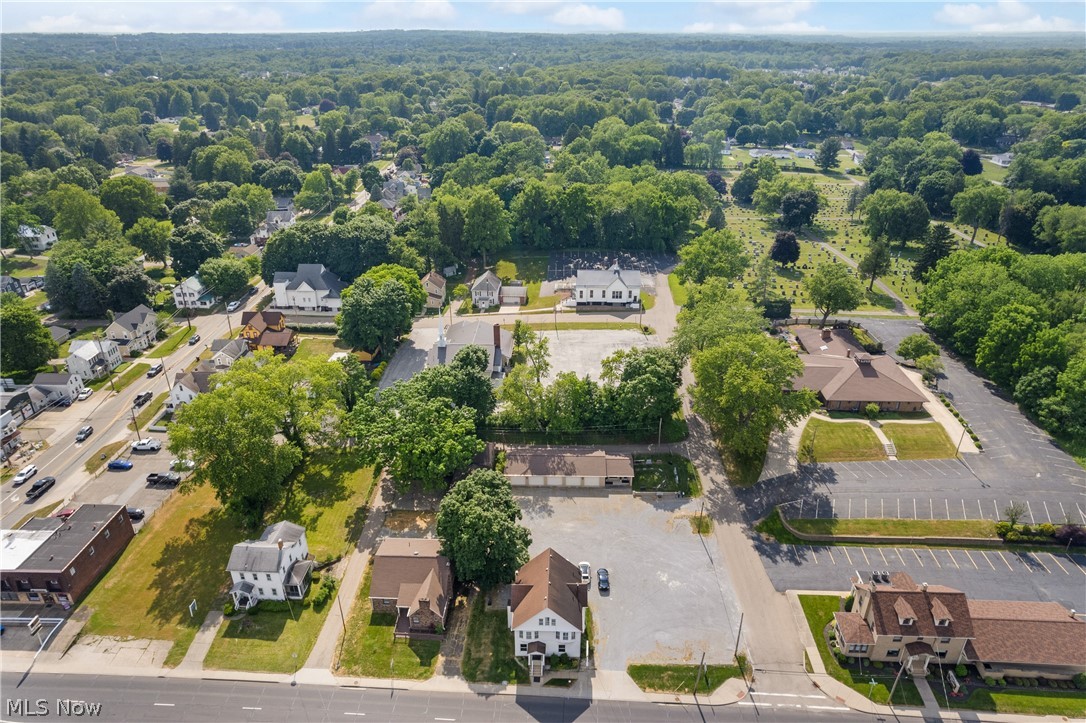 Check out this amazing commercial property in the square of Uniontown. This is located on 3/4 acre lot along Cleveland Ave w/a high traffic count and stretches from alley to Northdale street w/180 feet of frontage. There are 4 buildings on the property, plus a large parking area. House one is a stone building w/a newer roof and furnace. It offers a 3 large bedrooms 1.5 baths and about 2000 sq. ft. The original woodwork is in amazing condition and features solid wood doors. The second stone building is truly a must see and was completely gutted to the studs and finished in 2024. It shows like new construction and has a heated 2 car oversized garage. There is a huge master bedroom w/a new bathroom w/granite counter tops and 2 massive his/hers walk in closets. Building 3 features a first floor commercial rental space, currently occupied by long time flower shop plus a 2/3 bedroom full apartment upstairs. The 4th building is a massive 5 car brick garage w/2 separate heated bays, half bathroom and a separate office area. This building is great for a home business. This is a one of a kind property located in Lake Township. Great for an owner occupied w/home business plus extra rental potential. Call today for a private showing.