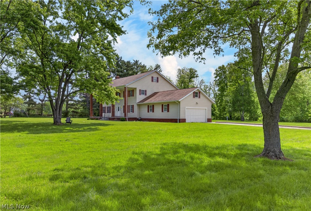 Private estate-style living on over 9 acres in Strongsville! This impressive colonial offers nearly 4,100 square feet including a walk-out lower level, spacious entertaining areas, fireplace, upper balcony, and flexible living space throughout. Tucked away in a peaceful setting yet conveniently located near shopping, dining, highways, and Strongsville schools, this property delivers the perfect blend of privacy and convenience.  Now vacant and move-in ready with immediate possession available. Rare opportunity to own acreage in one of Strongsville’s most desirable communities. Bring your vision and finishing touches to transform this unique property into a truly exceptional private retreat.  Rare opportunity. Endless possibilities.