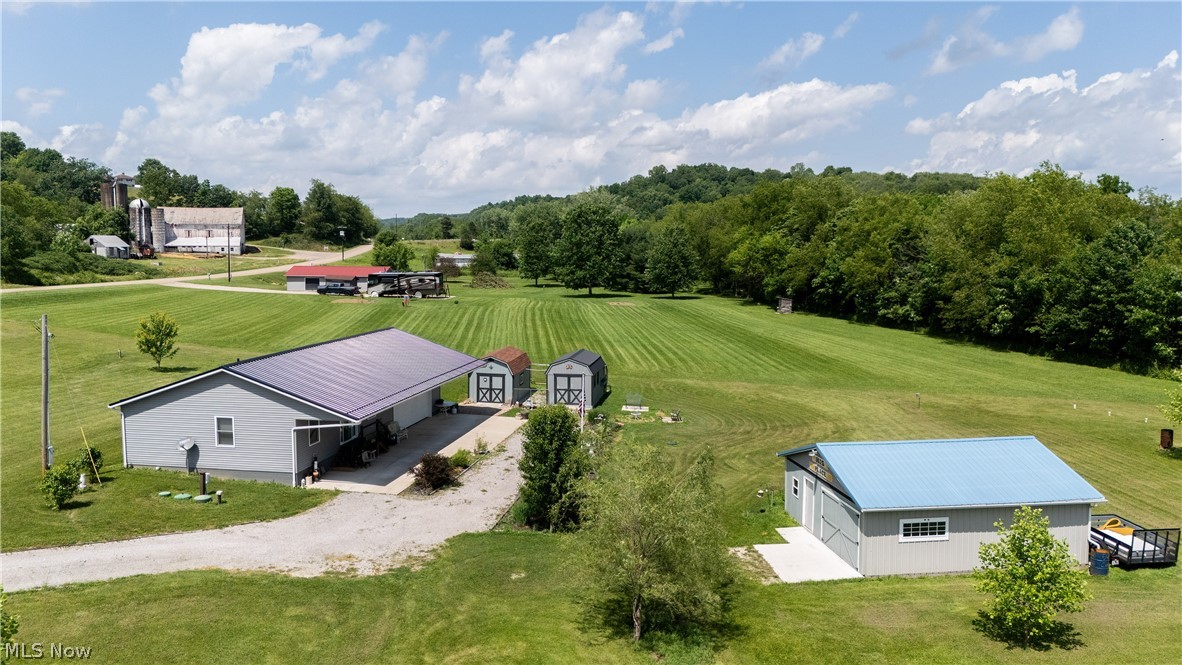 Embrace the ultimate freedom of country living on this stunning 2.336 acre property, offering endless possibilities to expand, homestead, or simply enjoy your own private retreat. Nestled on this expansive acreage is a quality-built 2020 ranch featuring 1 bedroom and 1 bathroom, perfectly designed for those who appreciate an efficient, modern layout and a simpler lifestyle. Attached to the home is a spacious 2 car garage that provides seamless convenience. Beyond the main home, the property is a hobbyist’s paradise, equipped with two detached sheds for excellent tool and equipment storage. A massive, separate enclosed pavilion adds incredible versatility to the property, offering a blank canvas that can easily be transformed into additional garage space, a workshop, or premier storage. Whether your vision involves growing into the vast acreage or enjoying the pristine, minimalist setup just as it is, this property delivers a unique foundation for your future. Call today to make your dreams a reality!