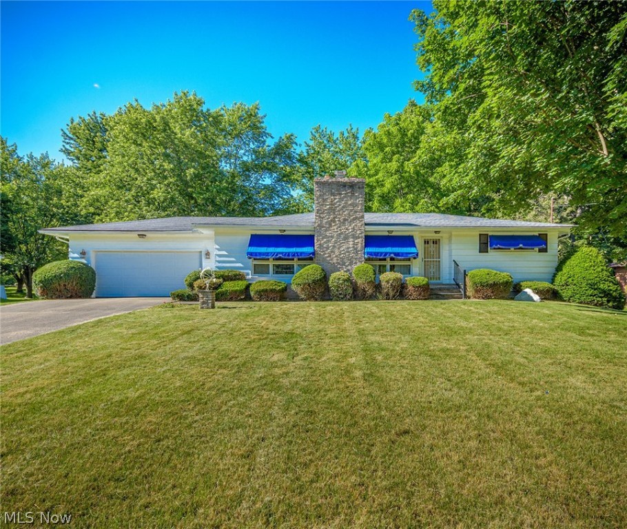 Lovely Ranch situated on 1.8 acres and includes one 2 car attached garage and one detached 2 car garage. Well loved and maintained in excellent condition for many years.  Extra deep concrete driveway affords plenty of room for parking . The foyer entry leads to the elegant formal living and dining rooms with neutral decor, crown molding , decorative columns and a full wall stone gas fireplaced. The kitchen is in pristine condition with the beautiful original wood cabinets, a built in breakfast bar and ceramic tile floor. There's wood trim and hardwood floors under the carpets and leading into the 3  bedrooms.  The basement has a nice sized finished rec room and a full second bath. Washer and dryer included. Home Warranty too. Must see.