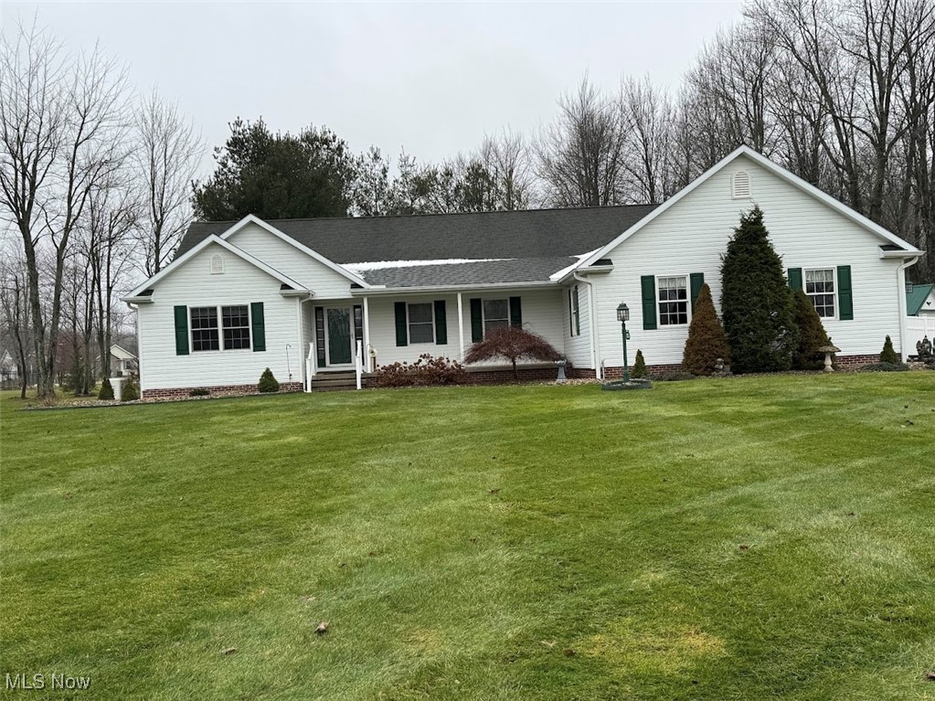 Comfortable, well-maintained home in a beautiful neighborhood just waiting to be called yours!  This home, with 2 (possibly 3) bedrooms and 2.5 baths, offers spacious and yet comfortable rooms. Off the front foyer is a large, carpeted bonus room that offers several possibilities: sitting room, office, bedroom, etc.  The Living room/dining room features a gas fireplace, plenty of light, and lots of room for entertaining family and friends.  The large kitchen features white cabinetry, Formica countertops, 2 large pantries, and an island counter.   A separate first-floor laundry, complete with cupboards for storage and a pull-down ironing board, makes wash day a breeze. The full 3-piece bathroom features a storage cabinet, tub/shower combination, and a Corian countertop around the sink.  The first bedroom is spacious and features two large closets.  The main bedroom offers plenty of room and light from the 2 skylights, and a ceiling fan.  It also has a large walk-in closet that adds plenty of room for storage.  The master bath features a convenient walk-in shower with sliding glass doors and double sinks with a marble countertop.  The large dry basement adds additional living space with a half bath, large open areas, and any use you can imagine.    A 3-season room with laminate flooring allows for the enjoyment of the beauty of the area. Additionally, there is a designated barbecue area and an adjacent hot tub, All enclosed with a  privacy fence.  A three-car attached garage with a convenient ramp. There is also an additional detached garage and a storage shed.
