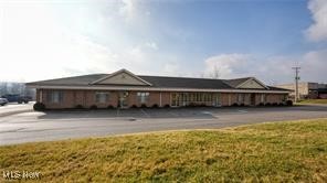 Unlock the potential of this expansive 9,800 square foot commercial office space, ideally configured and recently renovated to operate as a mental health outpatient facility. Featuring 66 private offices, this turnkey property offers ample space for individual therapy rooms, administrative offices, and collaborative workspaces. A welcoming reception area sets a professional tone upon entry, while multiple restrooms with shower facilities provide added convenience for staff and clients alike. The layout is designed for flexibility and efficiency, meeting the unique needs of healthcare, counseling, or other professional service operations. Strategically located just minutes from interstate access, the property offers unmatched regional convenience—less than an hour from all major cities—making it an ideal hub for organizations serving a wide geographic area.